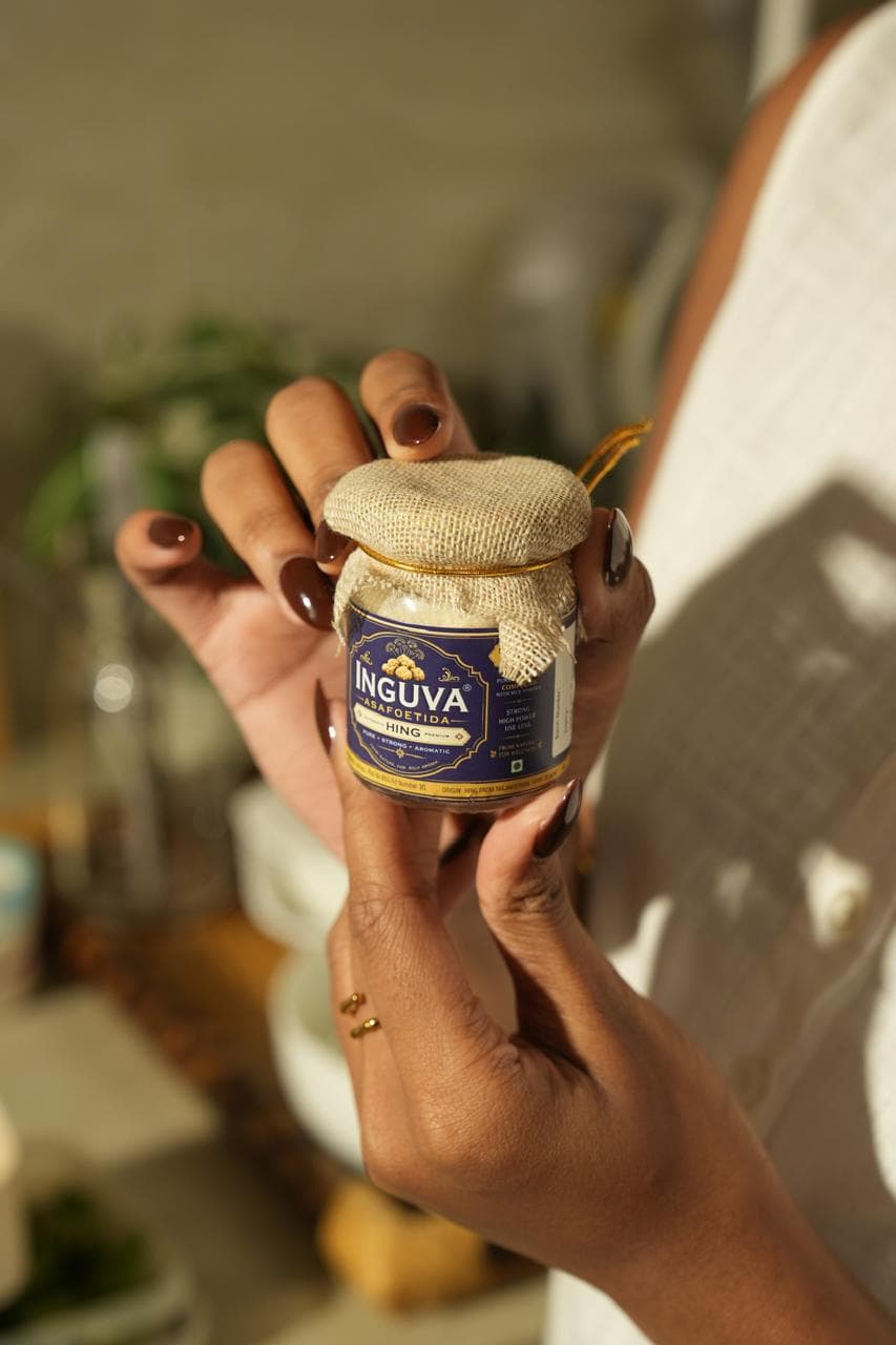 Inguva Hing jar held with care